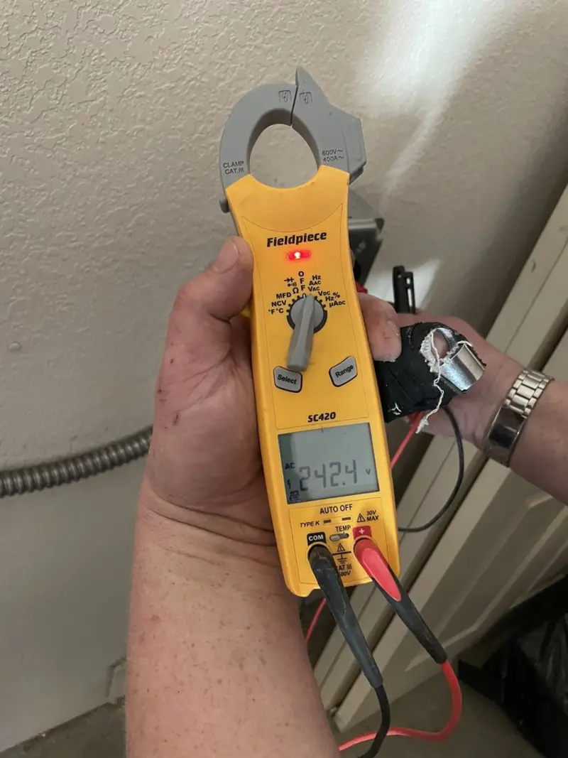 Voltage testing with clamp meter during Aluminum Wiring Replacement in Murphy